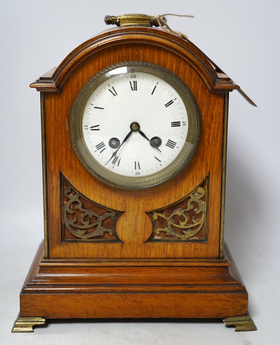 A 19th century mahogany eight day mantel clock with enamel dial and pendulum, 30cm high. Condition - fair, not tested